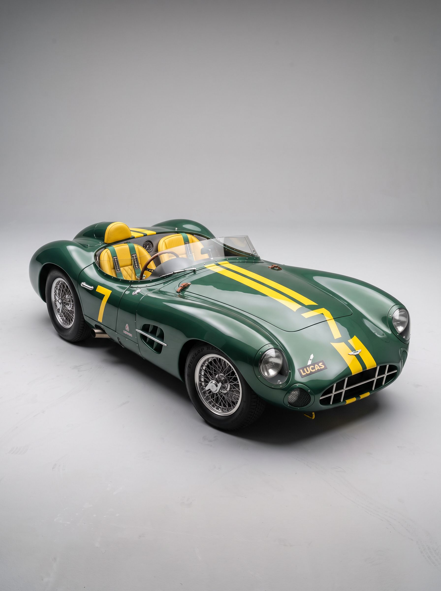 British racing green vintage speedster in a studio